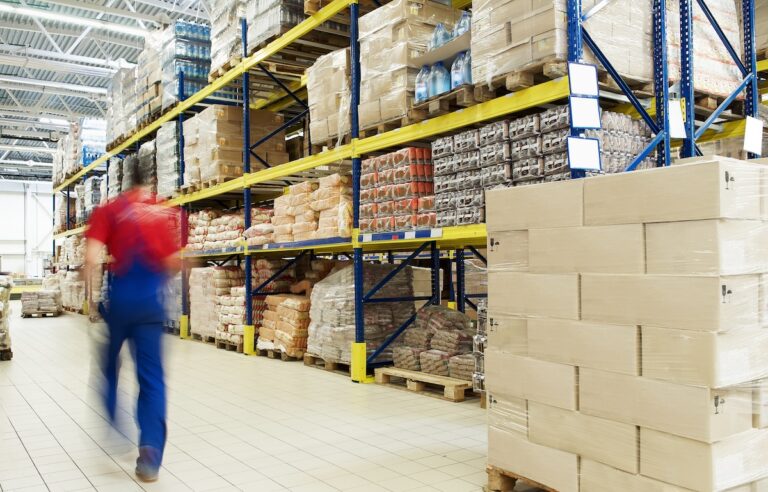 man walking through cash and carry wholesale distribution warehouse