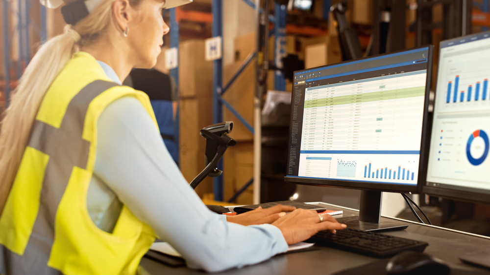 female warehouse manager using erp system