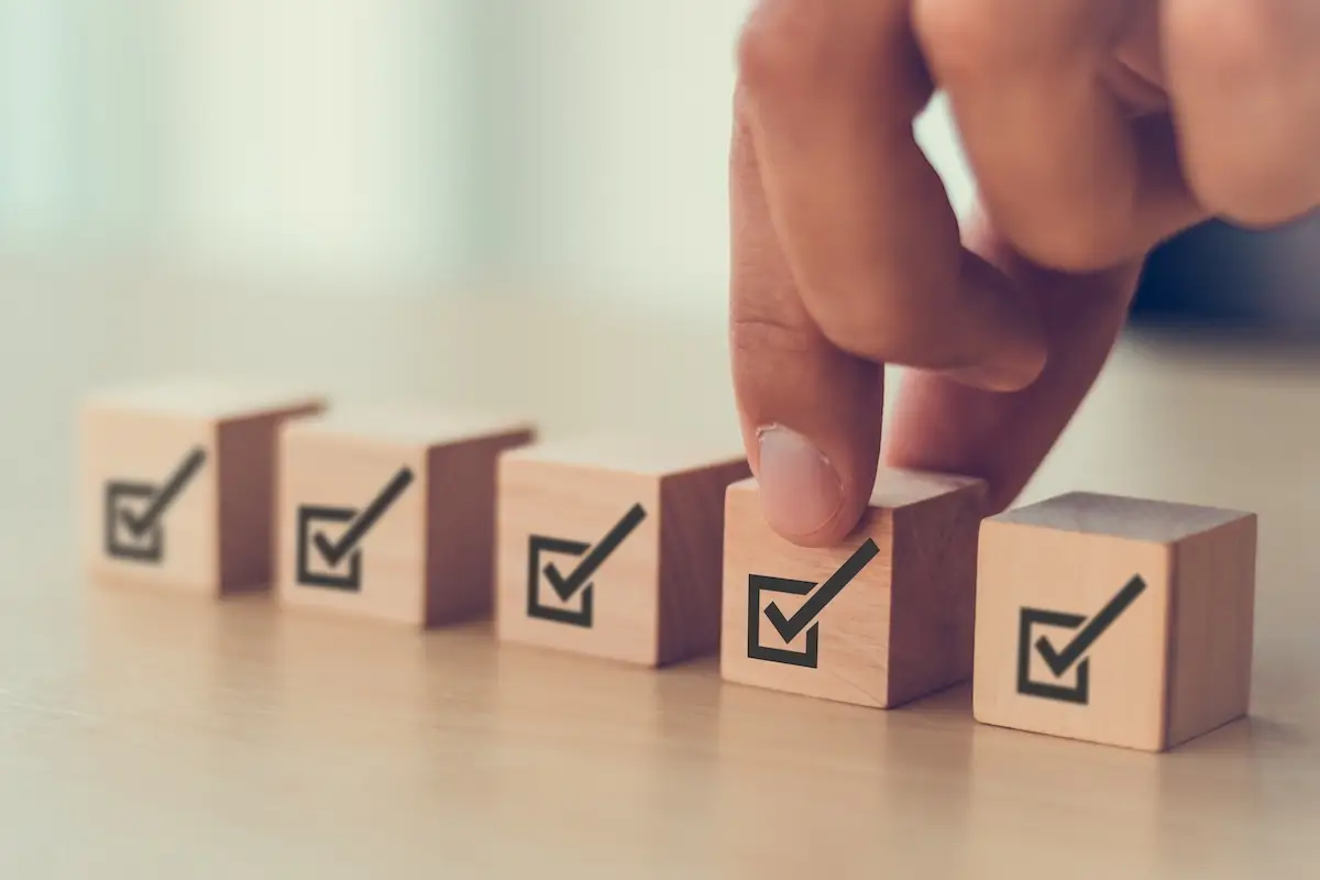 hand placing erp regulatory compliance checkboxes in a row