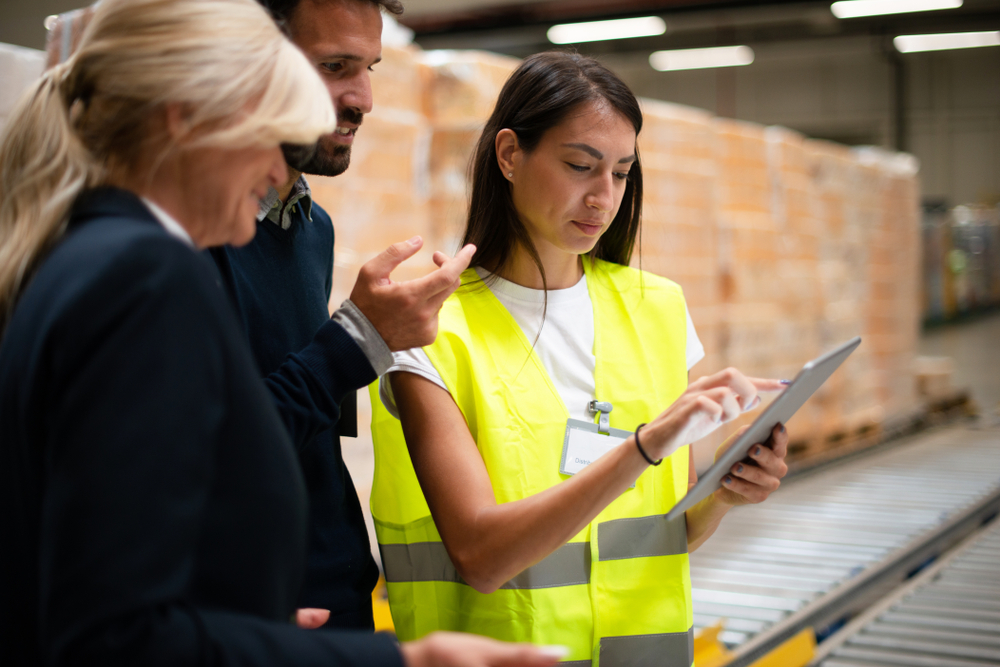 warehouse managers viewing erp total cost of ownership information