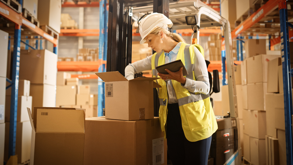 female inventory worker inspecting box