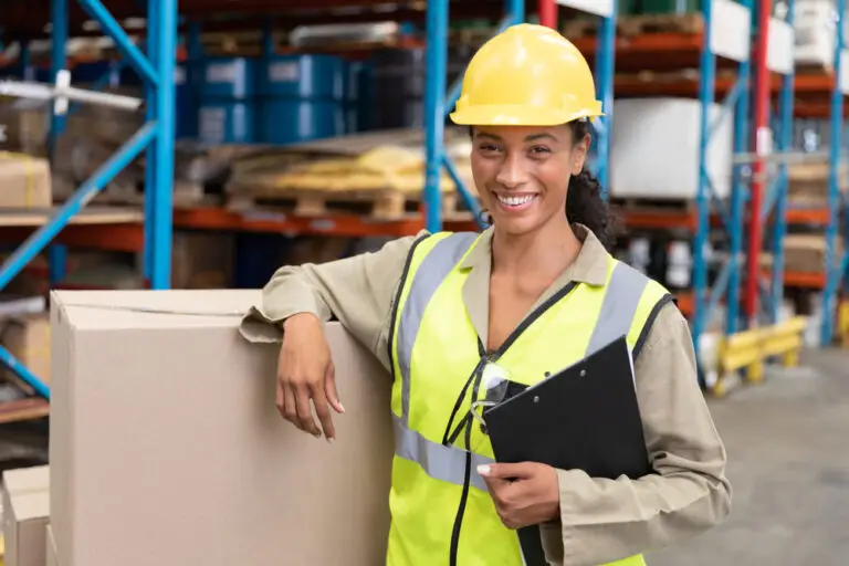 smiling female warehouse safety worker
