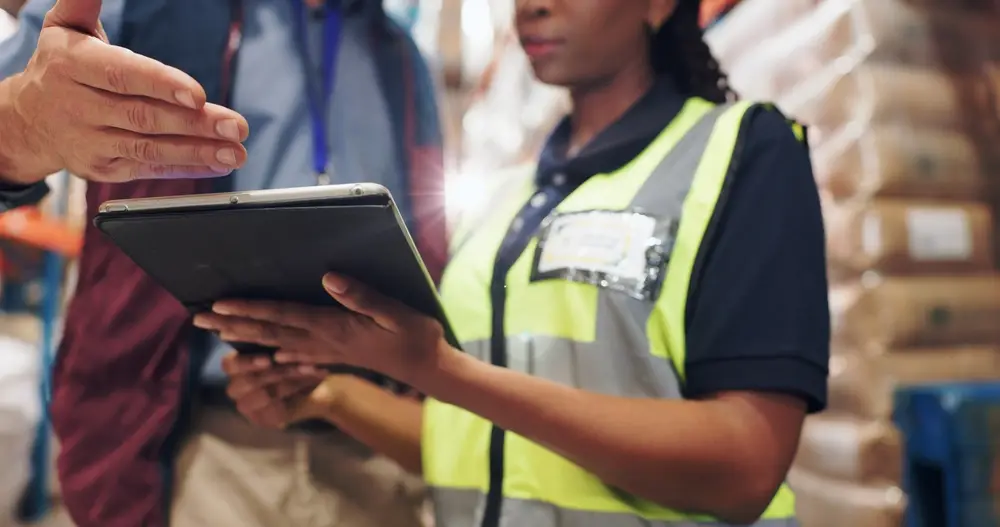 warehouse manager training female worker on lean operation 