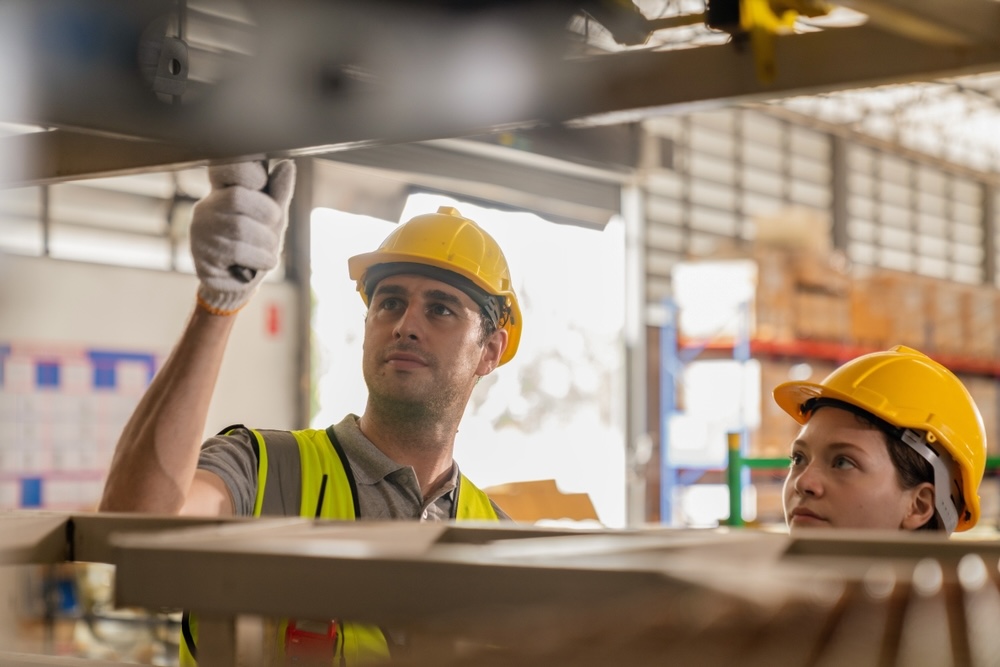 male and female warehouse workers scanning an item